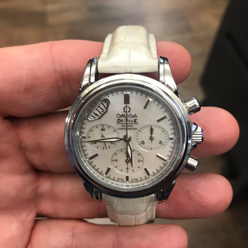 Omega ladies pre owned watch on a white strap